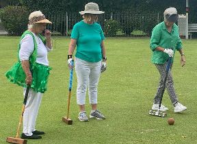 Betty James, Maryanne Waters and Gwenda Brennan wearing green for St Patrick's Day at Southport Croquet Club